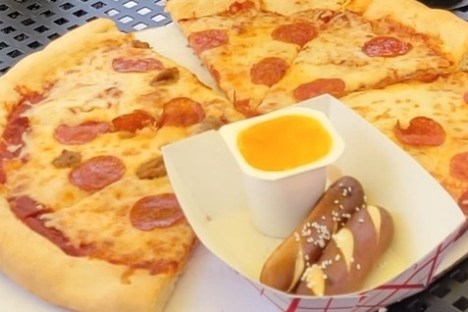 a plate of food with a slice of pizza