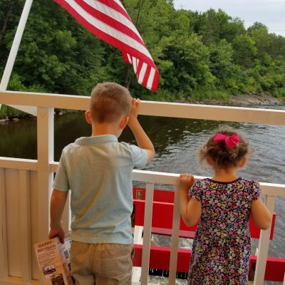 a young boy flying a kite