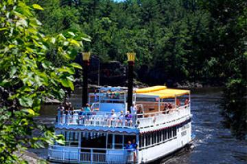 a boat is docked next to a body of water