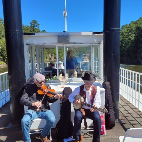 a group of people sitting in a parking lot