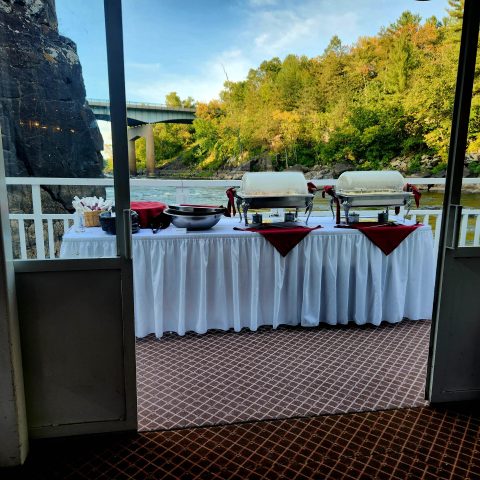 a bus that is parked on the side of a fence