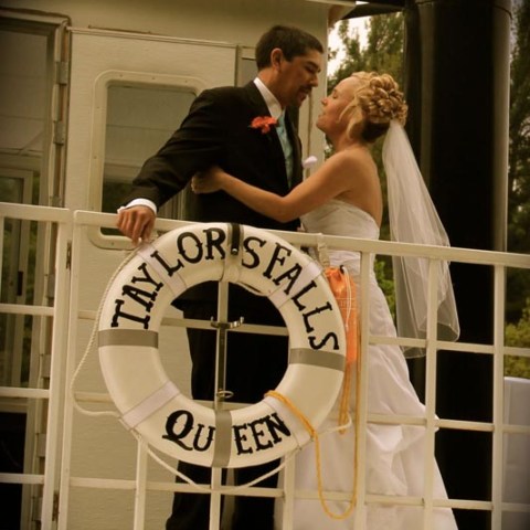 a man and a woman standing in front of a window