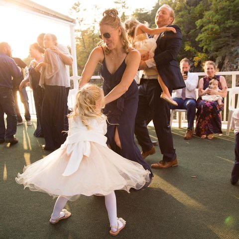 a group of people standing next to a person in a wedding dress