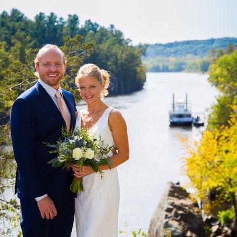 a person standing next to a river