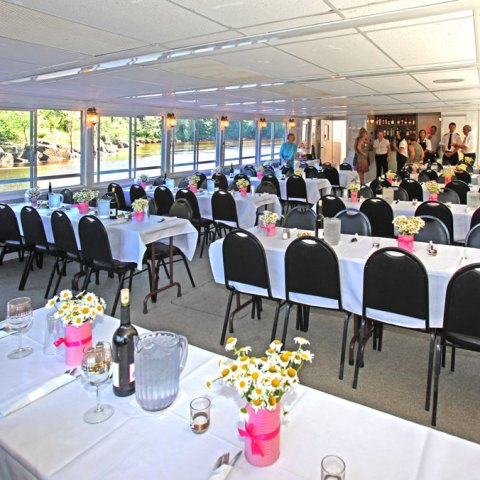 a group of people sitting at a table in a room