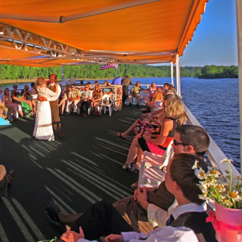 a group of people on a boat in the water