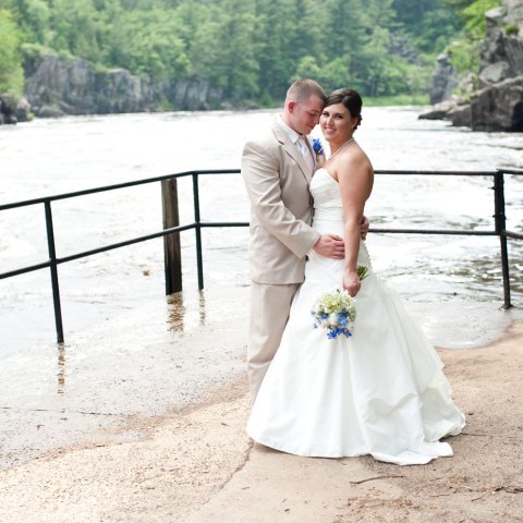 a person sitting on a bench with a mountain in the background