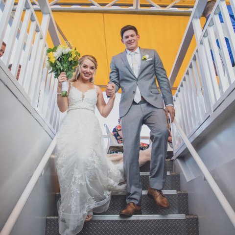 a person standing next to a fence