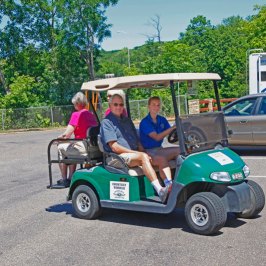 a person riding on the back of a truck