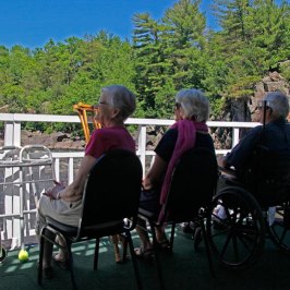 a group of people riding on the back of a bicycle