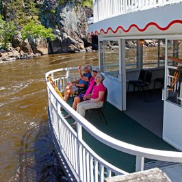 a group of people on a boat in the water