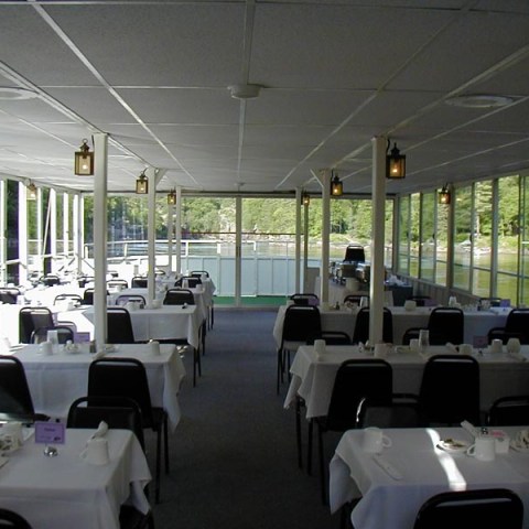 a room filled with furniture and a large window