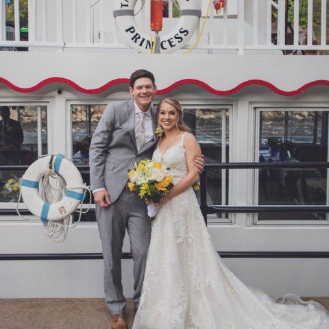 a man and a woman standing in front of a building