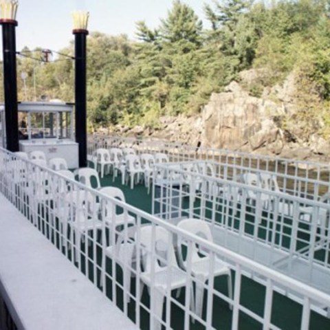 a herd of sheep walking across a bridge