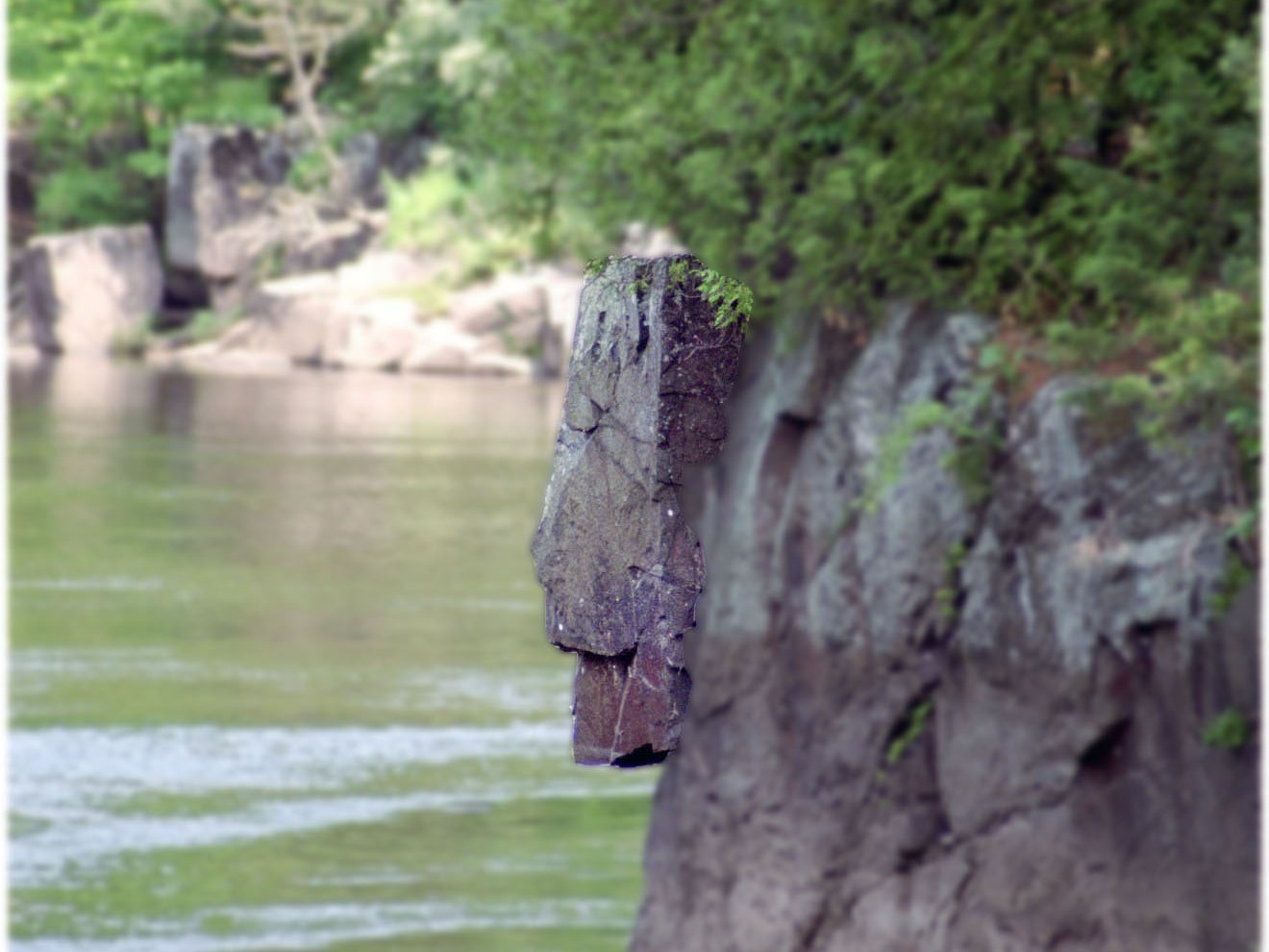 Rock formation like lions head next to water