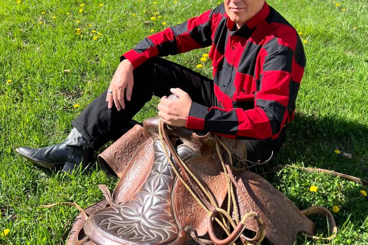 a man sitting on the grass