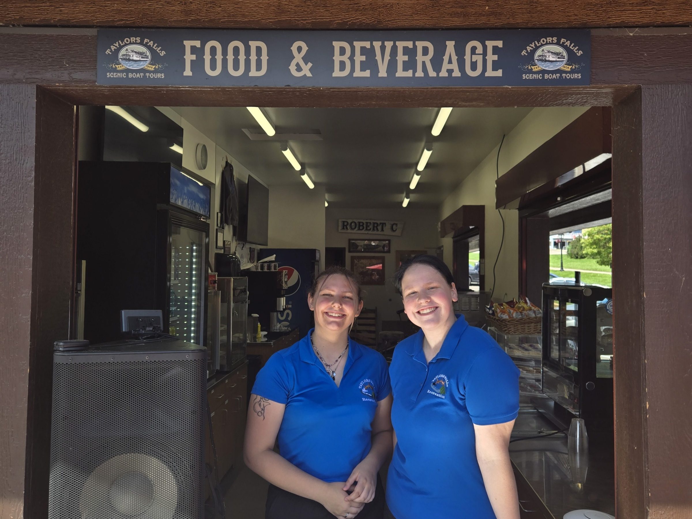 a man and a woman standing in front of a building